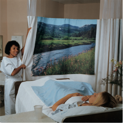 A patient receiving sounds and views of nature before an operation - Source (1)