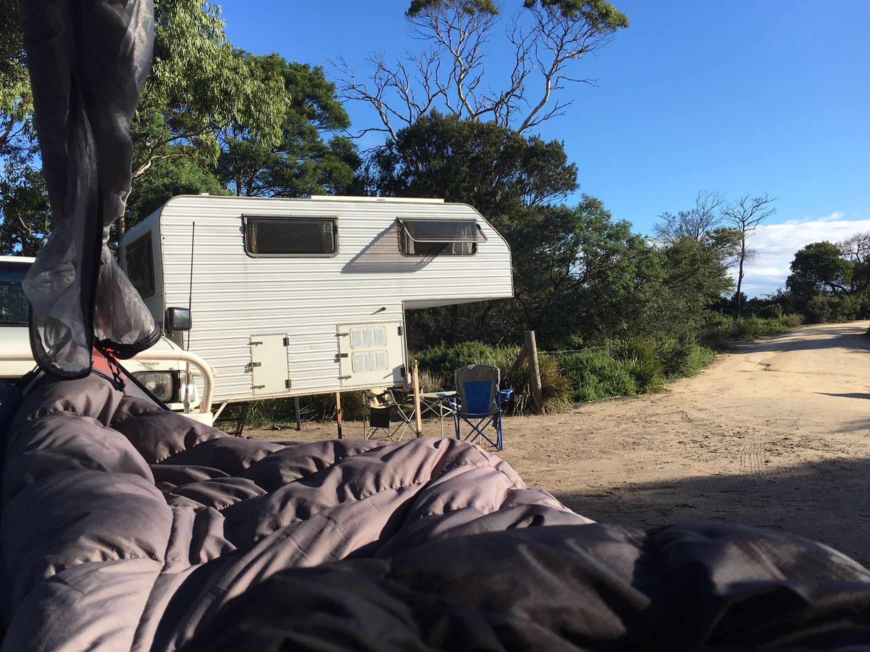 Reflecting in the tree tent hammock with a view onto the Atmosphaeres Field Office