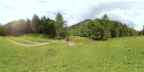 Mountain Hut In Forest Near Stream