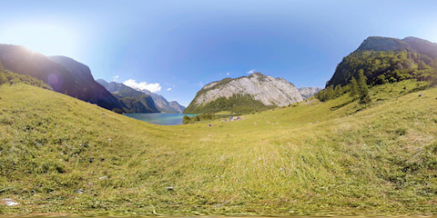 View Of Serene Alpine Lake From Meadow