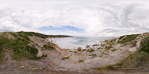 Overcast Beach With Red Rocks
