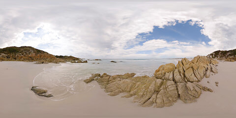 Red Rock Beach Waves Rolling Close Up
