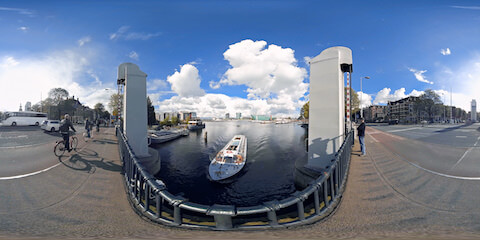 Amsterdam Carbridge Over Canal Nemo In Distance