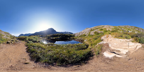 Quiet Mountain Lake In Norwegian Landscape