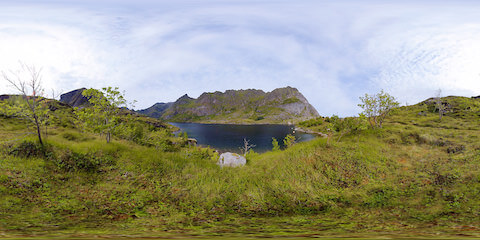 Scenic View Of Mountain Lake On Overcast Day