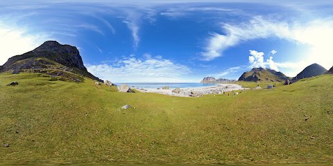 Overlooking Ocean From Grass Near Foot Of Mountain