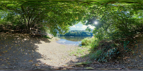 Small Boat Passing By On Calm Lake