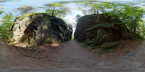 Hiking Path Through Ravine Flanked By Rocks