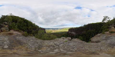 Fog Rising From Forest In Rugged Mountain Valley