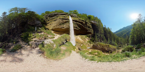 High Waterfall In Mountains From Below