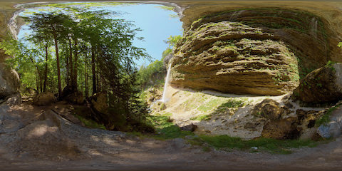 High Waterfall In Mountains From Side