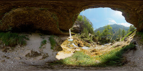 Cave View Of Waterfall And Mountain Landscape