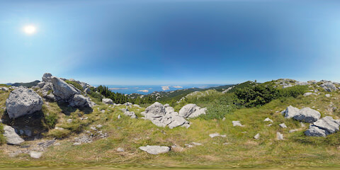 Rock-Strewn Grasslands Overlooking Forested Valleys
