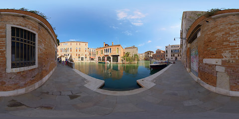 Idyllic Canal With Venetian Architecture And Garden