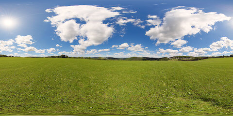 Blue Sky And White Clouds Over Lush Green Meadow
