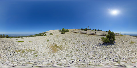 Barren Landscape Of Mont Ventoux Mountain With Cyclists On Road