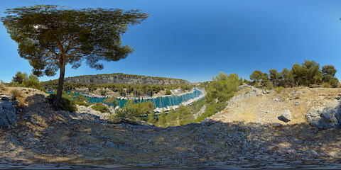 Tree Shaded View Of Sailing Boats Along Mediterranean Fjord
