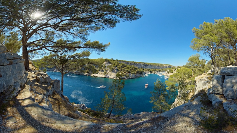 Turquoise bay framed by pine trees along the Mediterranean coast of Provence.